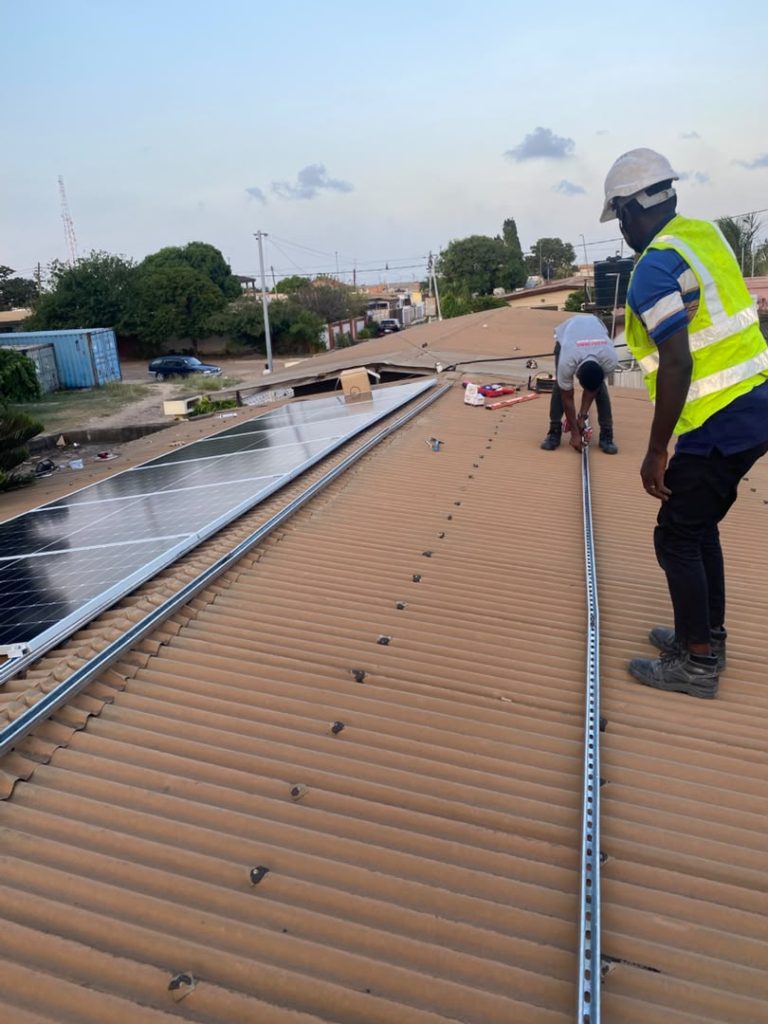 Cmerax solar panel installation, wide rooftop view