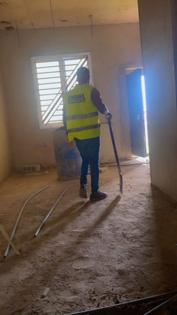 Cmerax technician running conduit wiring inside a building